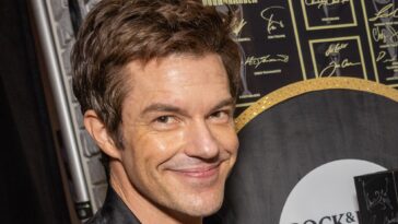 "Brandon Flowers discusses focusing on solo projects this year, reflecting on the challenges of quickly creating an album on the road despite increased computer use."]