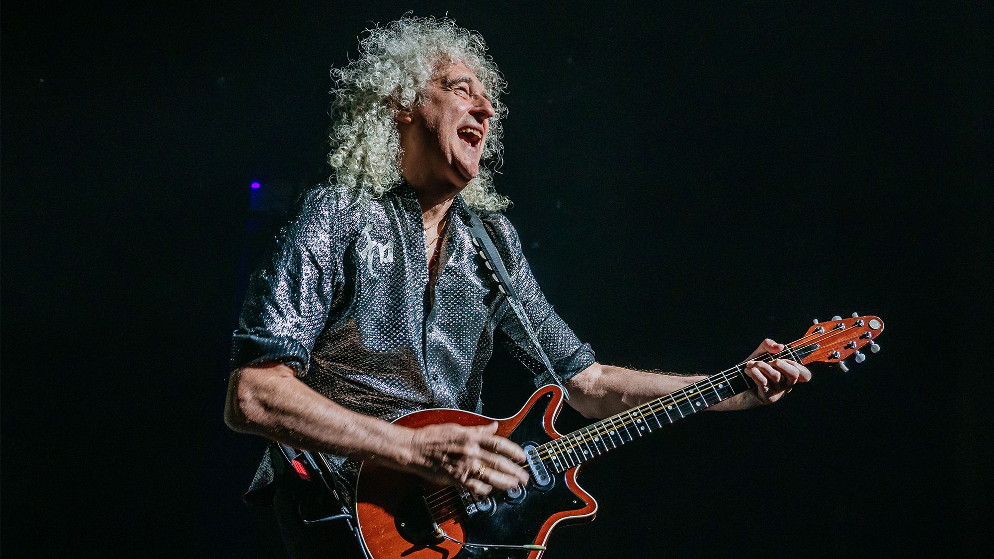 Brian May reveals why Queen declines to perform at Glastonbury.]