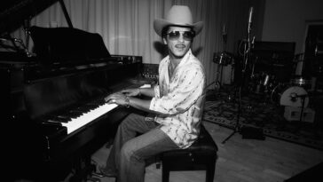 "Bruno Mars Responds to Social Media Critic Who Claims He's Been Releasing the Same Song for a Decade Over His New Single, 'I Just Might'"]