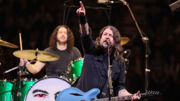 "Get ready for our return! Dave Grohl hints that a brand new album filled with exciting tracks is on the horizon."]