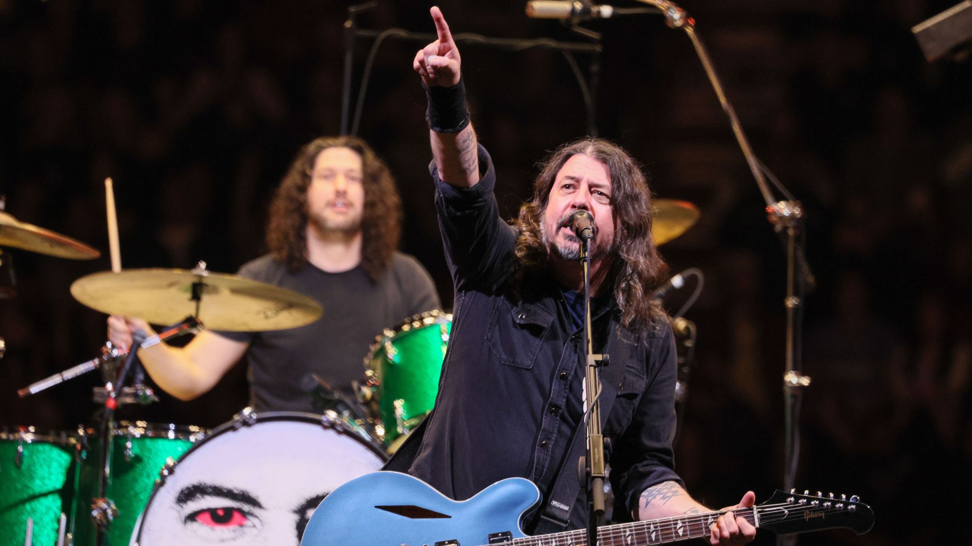 "Get ready for our return! Dave Grohl hints that a brand new album filled with exciting tracks is on the horizon."]