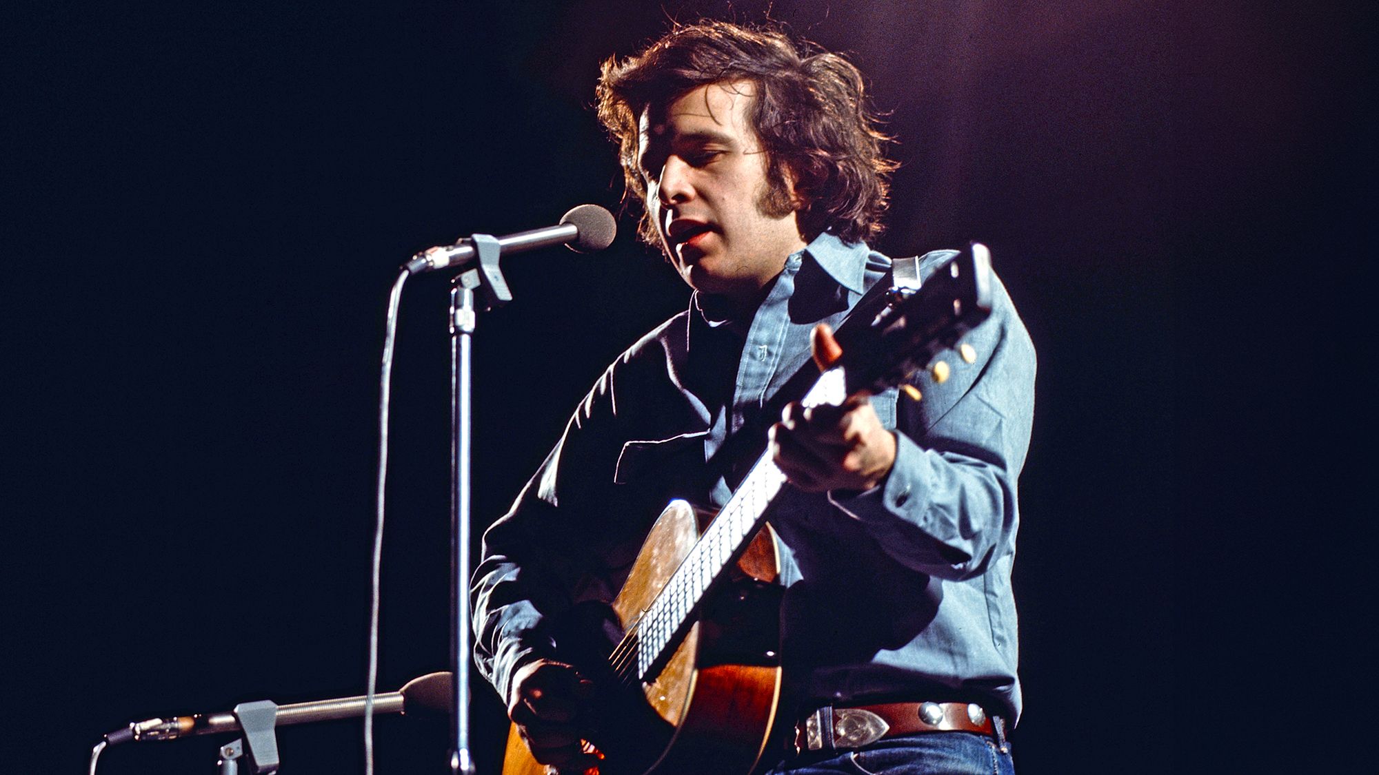 "Navigating Battles for Song Releases: How a 1970s Rock Icon Achieved His Second Major Hit and Why It Still Feels Like a Burden After 50 Years"]