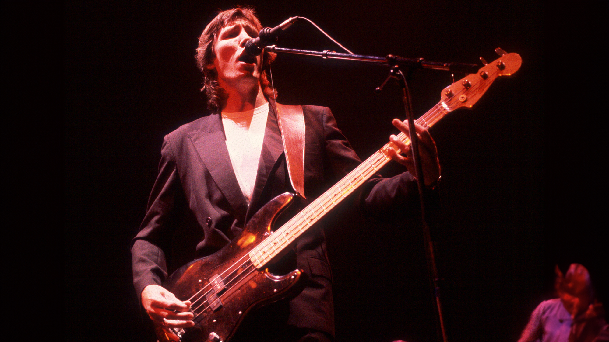 English Rock musician Roger Waters plays bass as he performs onstage at the Rosemont Horizon, Rosemont, Illinois, July 24, 1984.