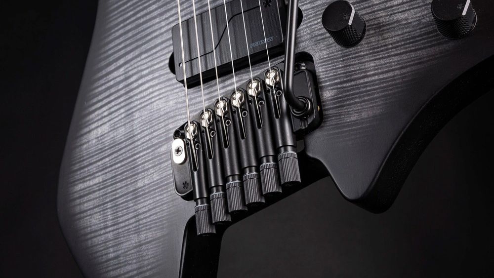 "Reimagining Movement, Stability, and Reaction": Strandberg’s innovative Arc TILT tremolo is crafted to enhance a more intuitive, expressive, and inspiring playing experience.]