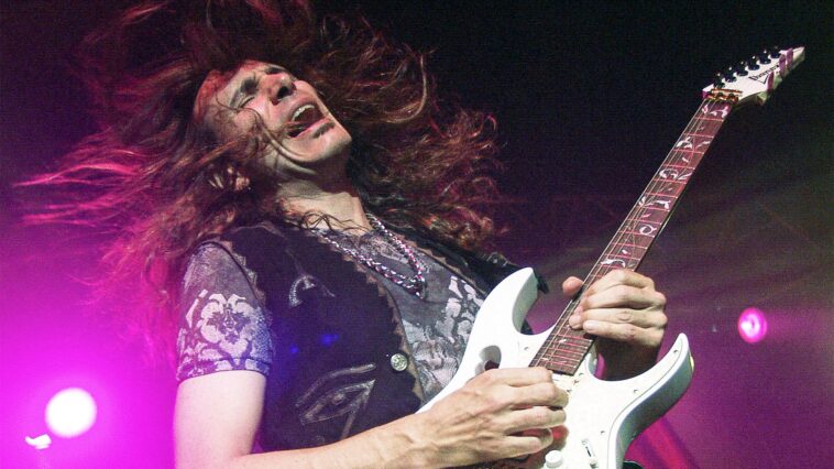 "Steve Vai Reflects on His Early Naiveté: How a Fellow Guitarist Came to His Rescue with Essential Gear in David Lee Roth's Band"]