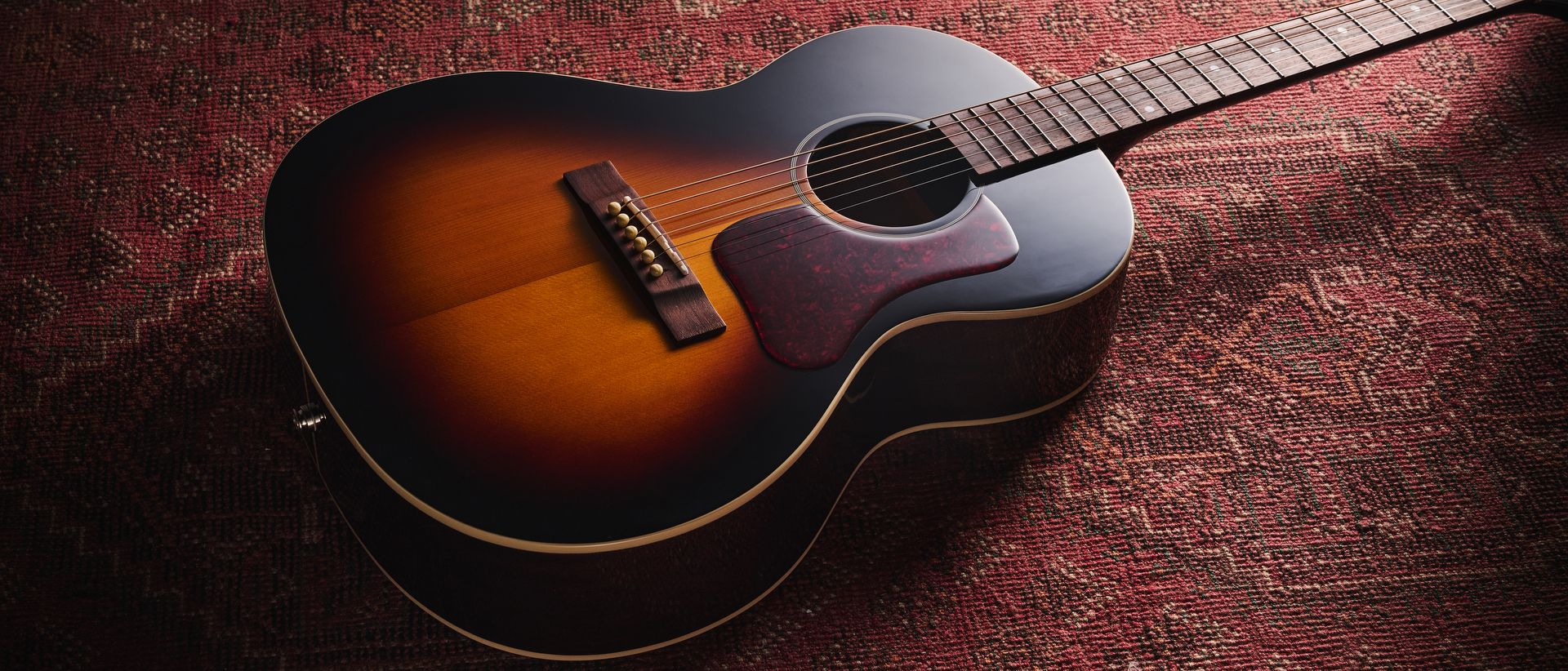 "This guitar excels in the hands of blues and folk players"—Review of the Epiphone Blues King Studio.]