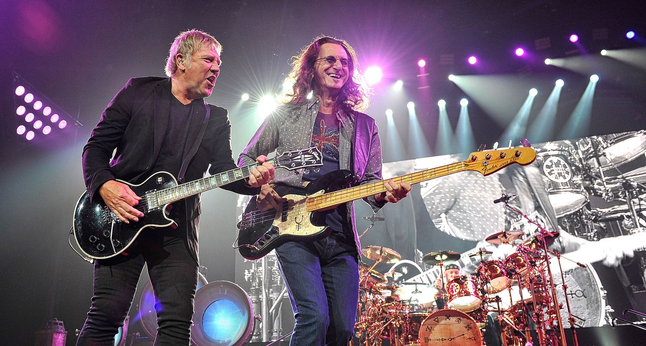 “Uncertain Future, But Geddy Lee Hints at New Rush Music: Collaboration with Alex Lifeson Possible if They 'Make It Through the Tour'”]