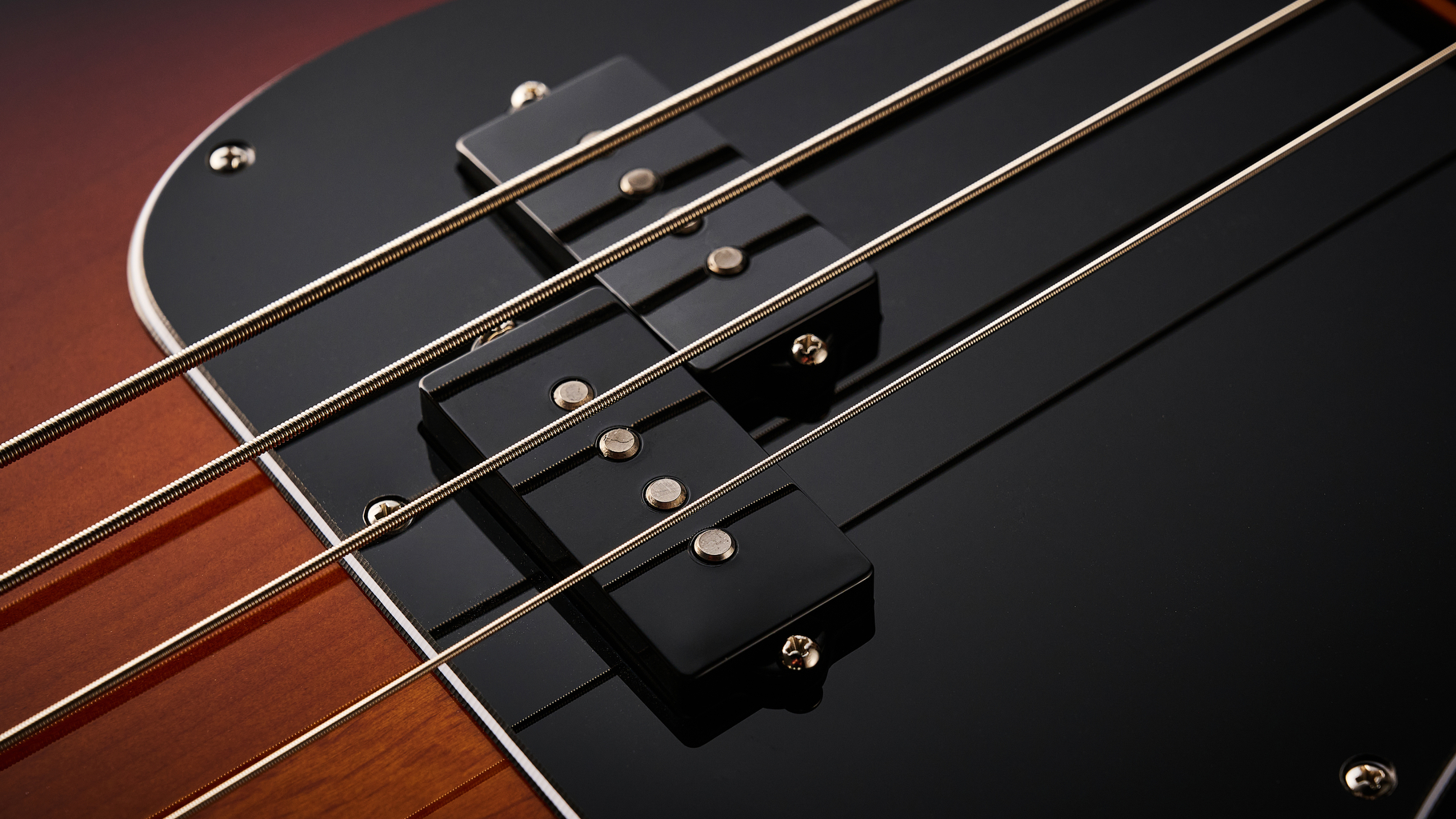 Fender American Professional Classic Precision Bass in 3-Color Sunburst shot on wood floor boards