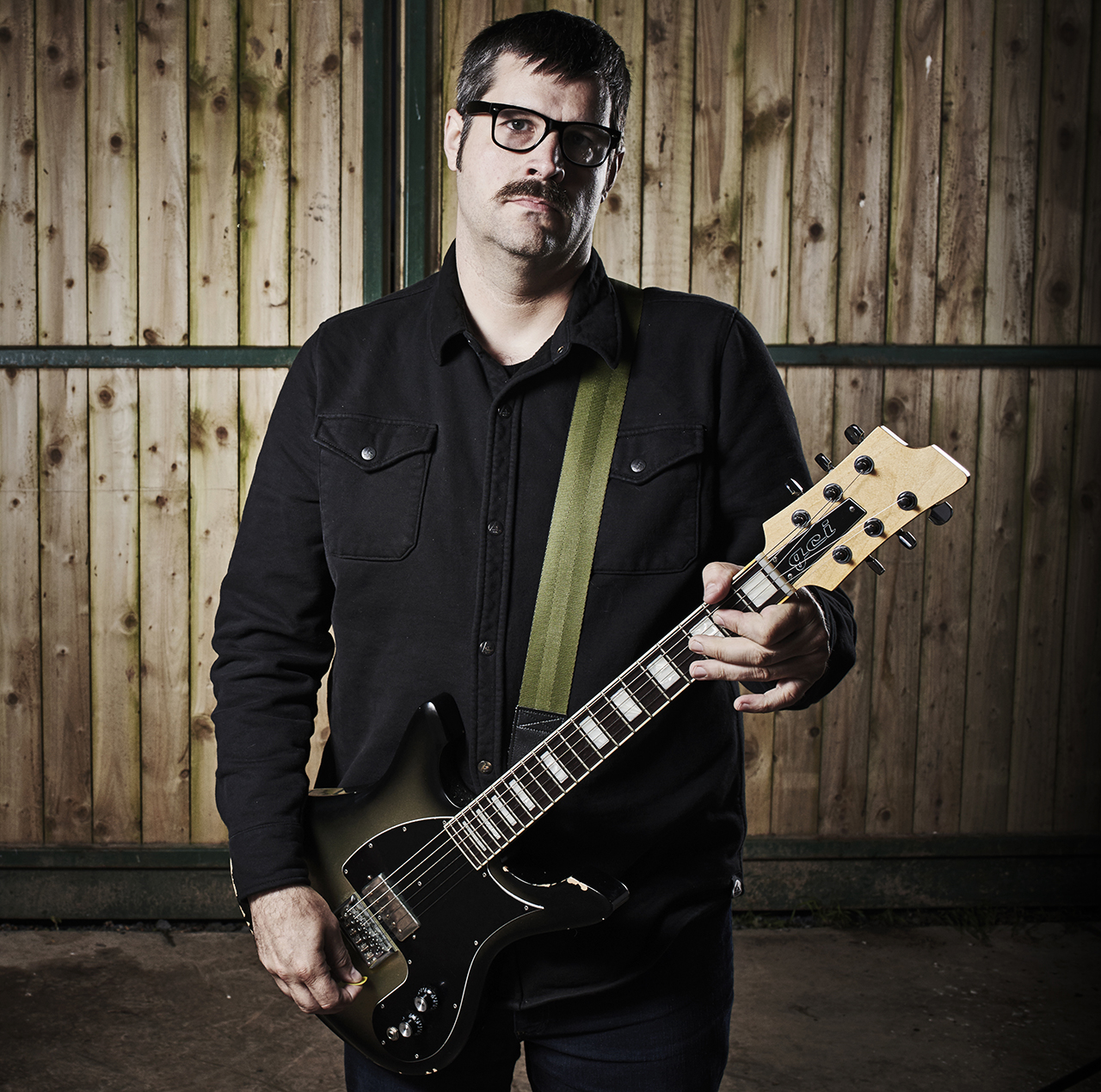 Portrait of American musician and producer Kurt Ballou, guitarist with heavy metal group Converge, photographed backstage at ArcTanGent Festival in Compton Martin, England, on August 18, 2017.