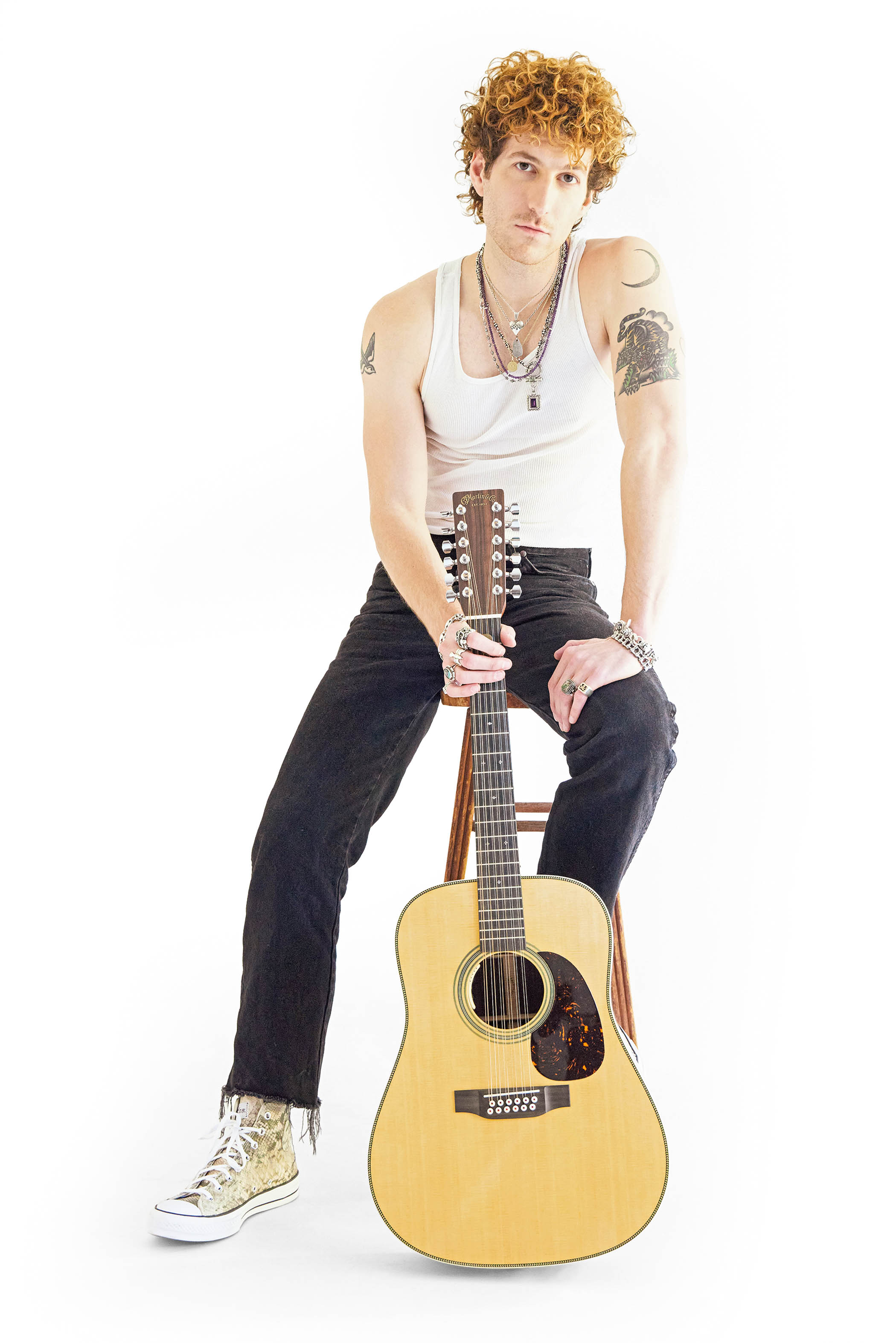 Evan Stanley poses with a Martin 12-string