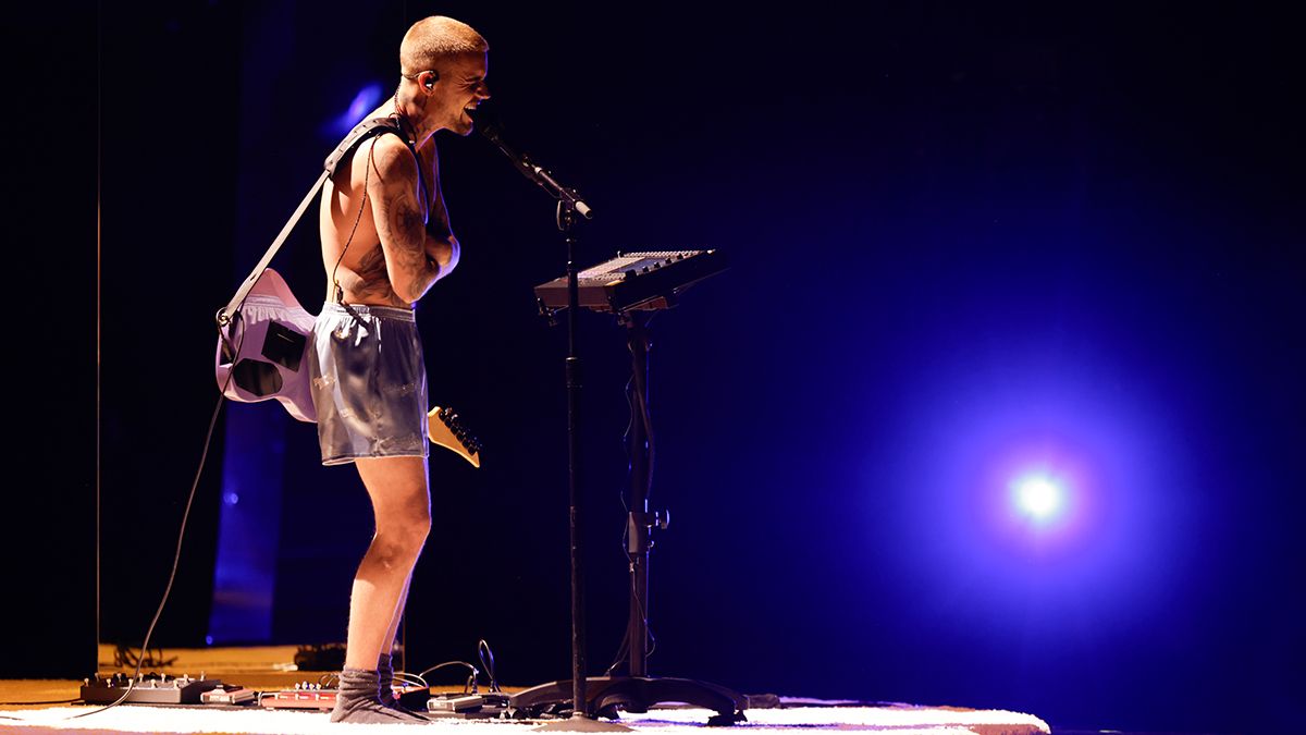 Justin Bieber delivered the most literal "stripped-down" performance at the Grammys, showcasing an '80s Yamaha electric guitar and an Akai MPC Live III while wearing only his underwear.]