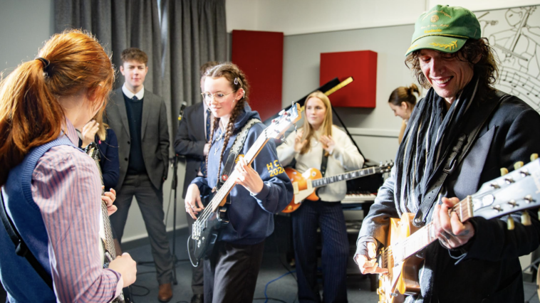"Justin Hawkins Launches Recording Studio at Hereford Cathedral School: 'I Wish We Had Something Like This in My School'"]