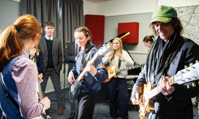 "Justin Hawkins Launches Recording Studio at Hereford Cathedral School: 'I Wish We Had Something Like This in My School'"]