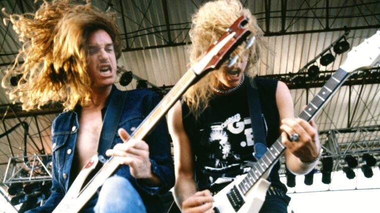 "Lars and I spotted him headbanging at the Whiskey. 'Let's recruit that guitarist… oh wait, he’s on bass!' This slender guy in bell bottoms was playing a wah solo. 'Impressive, we need him!'": James Hetfield reminisces about Metallica icon Cliff Burton's legacy.]