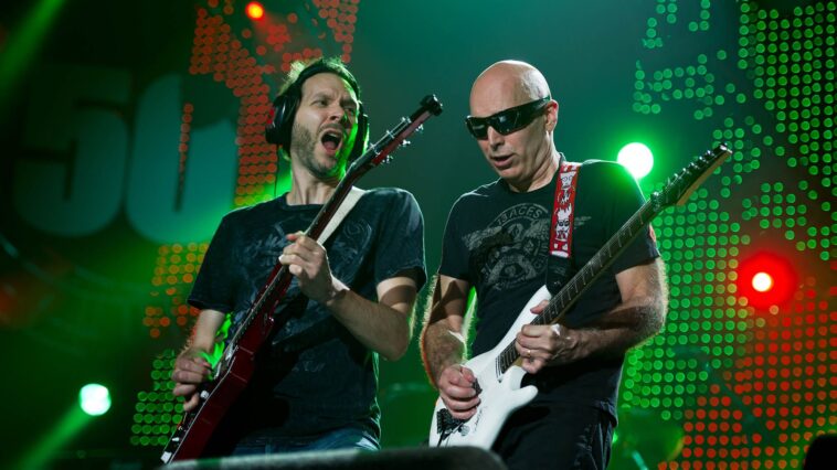 "Paul Gilbert Reflects on Joe Satriani's Insight: 'Each Album Feels Like a Challenge to Showcase My Guitar Skills' — Understanding the Temptation to Shred"]