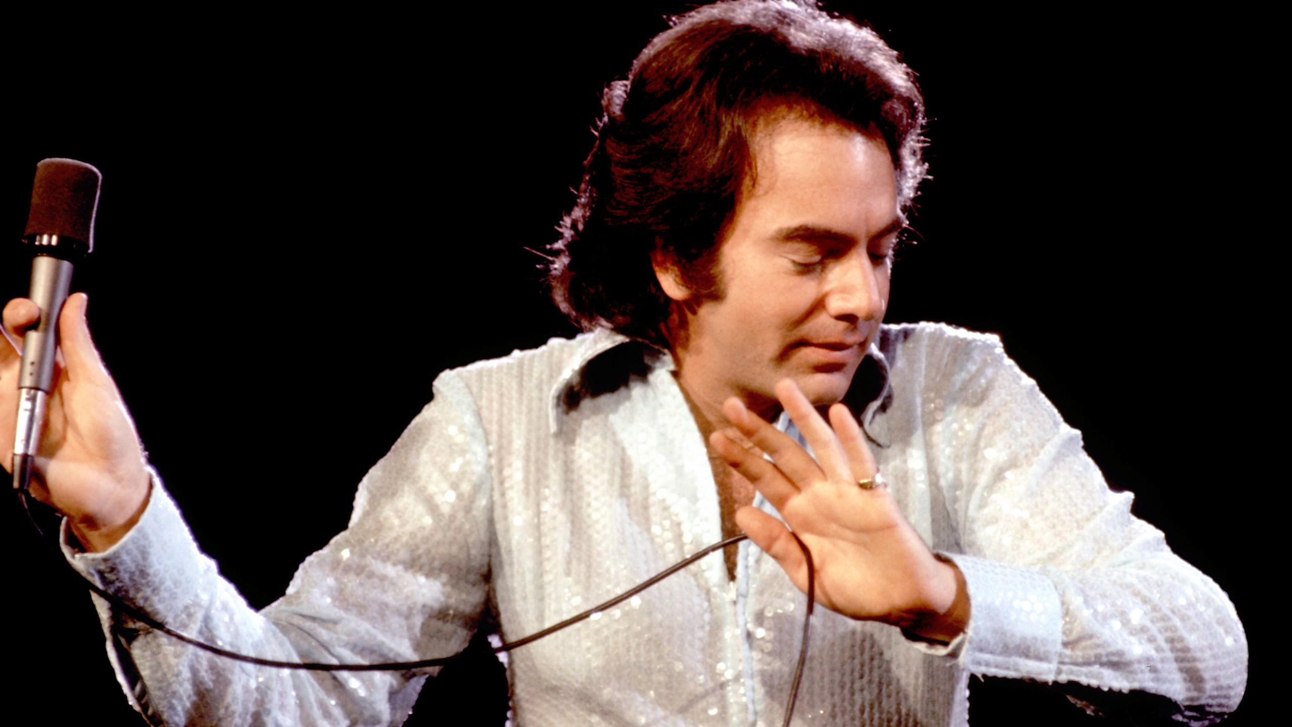 "Reflecting on the idea of creating a song with just one chord, I discovered a unique freedom through that limitation," recounts Neil Diamond's groundbreaking collaboration with Robbie Robertson of The Band.]