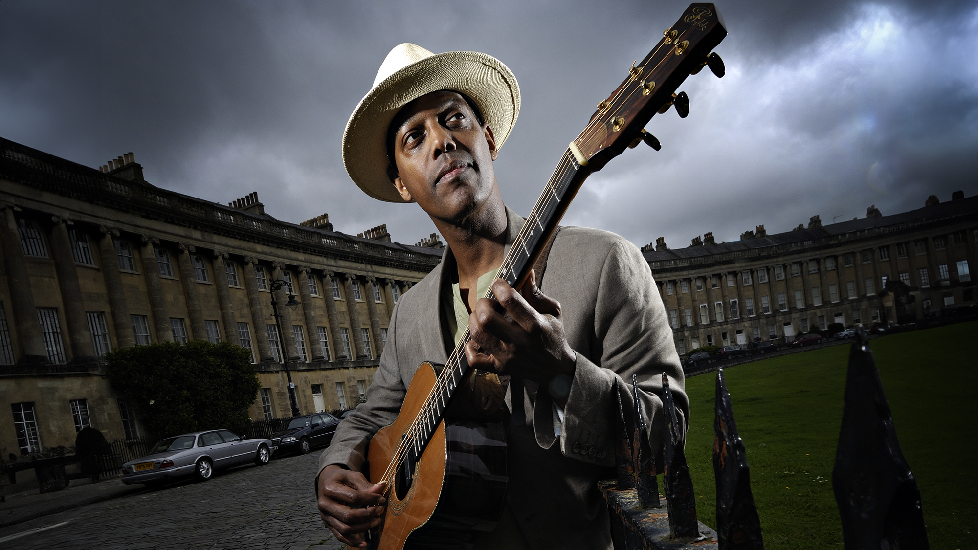 Portrait of American blues musician Eric Bibb posing with his signature Fylde acoustic guitar at the Royal Crescent in Bath, on July 14, 2008.