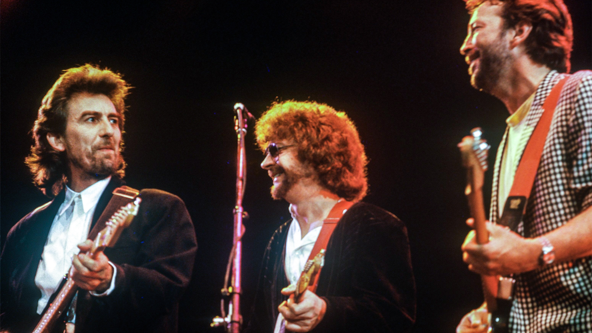 George Harrison, Jeff Lynne and Eric Clapton at the Princes Trust Concert on June 05, 1987 in London, United Kingdom.