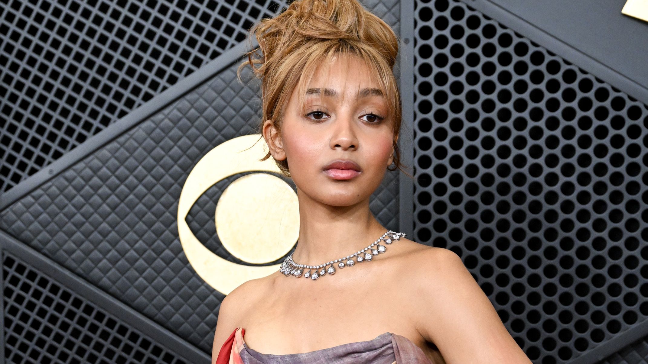 "To put it simply, I lacked a microphone but had a karaoke game on the Nintendo Wii that came with one": PinkPantheress makes history as the first female to win Producer of the Year at the BRIT Awards.]