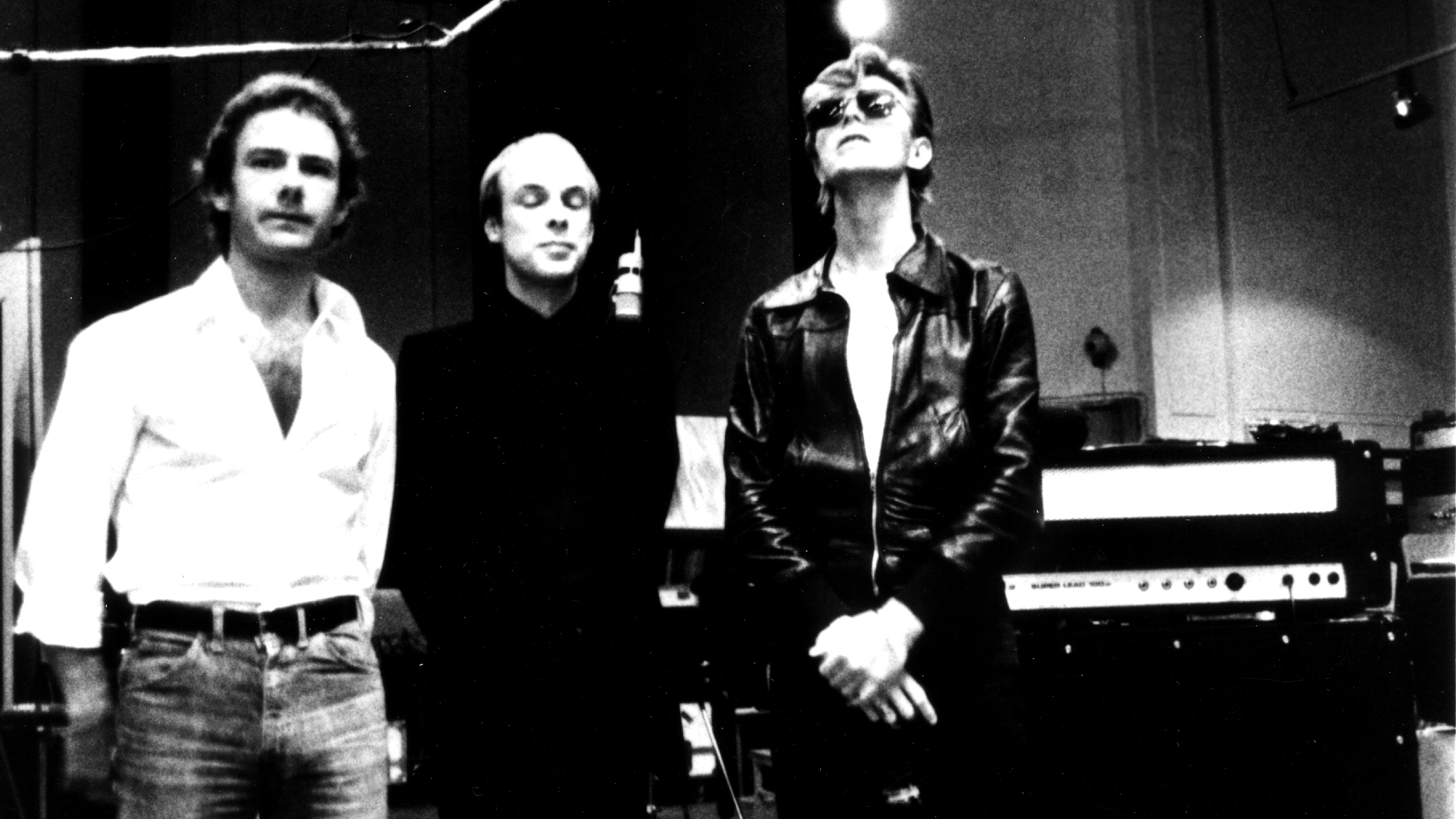 BERLIN - 1977: Robert Fripp, Brian Eno and David Bowie pose for a portrait in the studio where they are recorded "Heroes" in 1977 in Berlin, Germany.