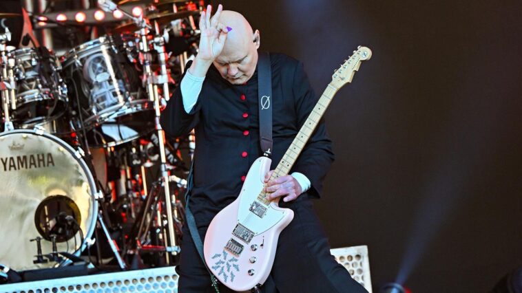 "Why Eric Clapton's Fame Isn't Just Due to His Guitar Skills: Billy Corgan Claims Virtuoso Solos Lack Relevance in the Social Media Era and Calls for Guitar Influencers to Shape Popular Music More Effectively"]