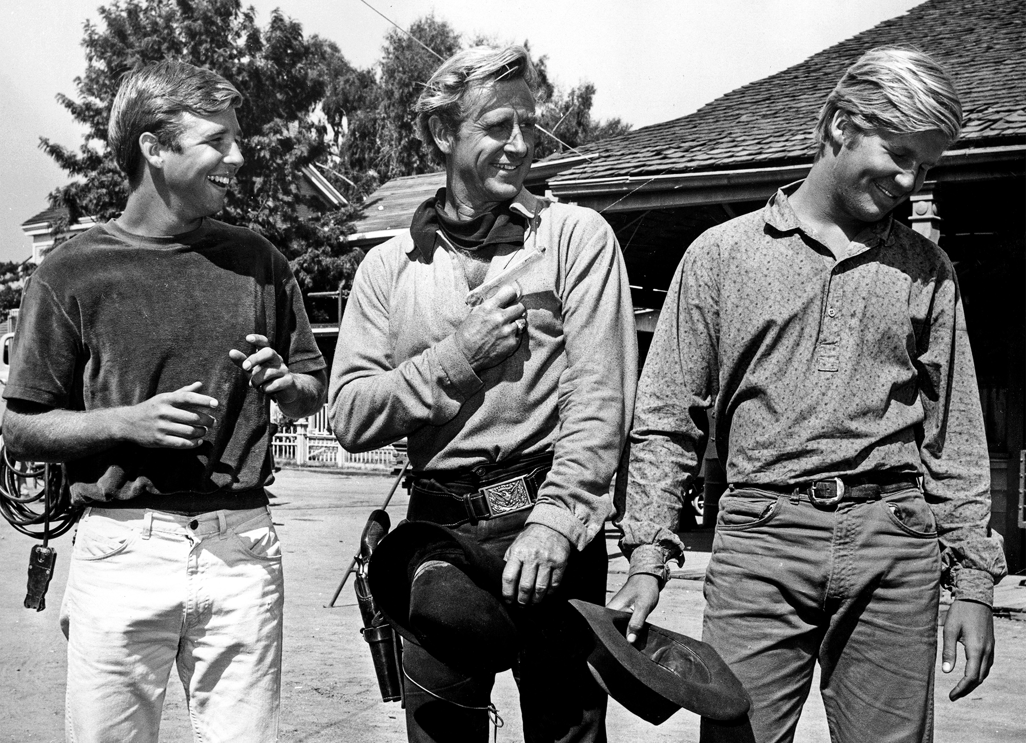 American actor Lloyd Bridges (1913 - 1998) with his sons Beau (left) and Jeff (right) on a western film set, circa 1975.