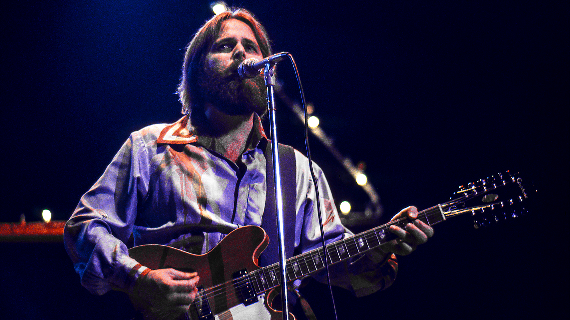 Carl Wilson performs with the Beach Boys at Oakland Coliseum Arena on December 15, 1976 in Oakland, California.