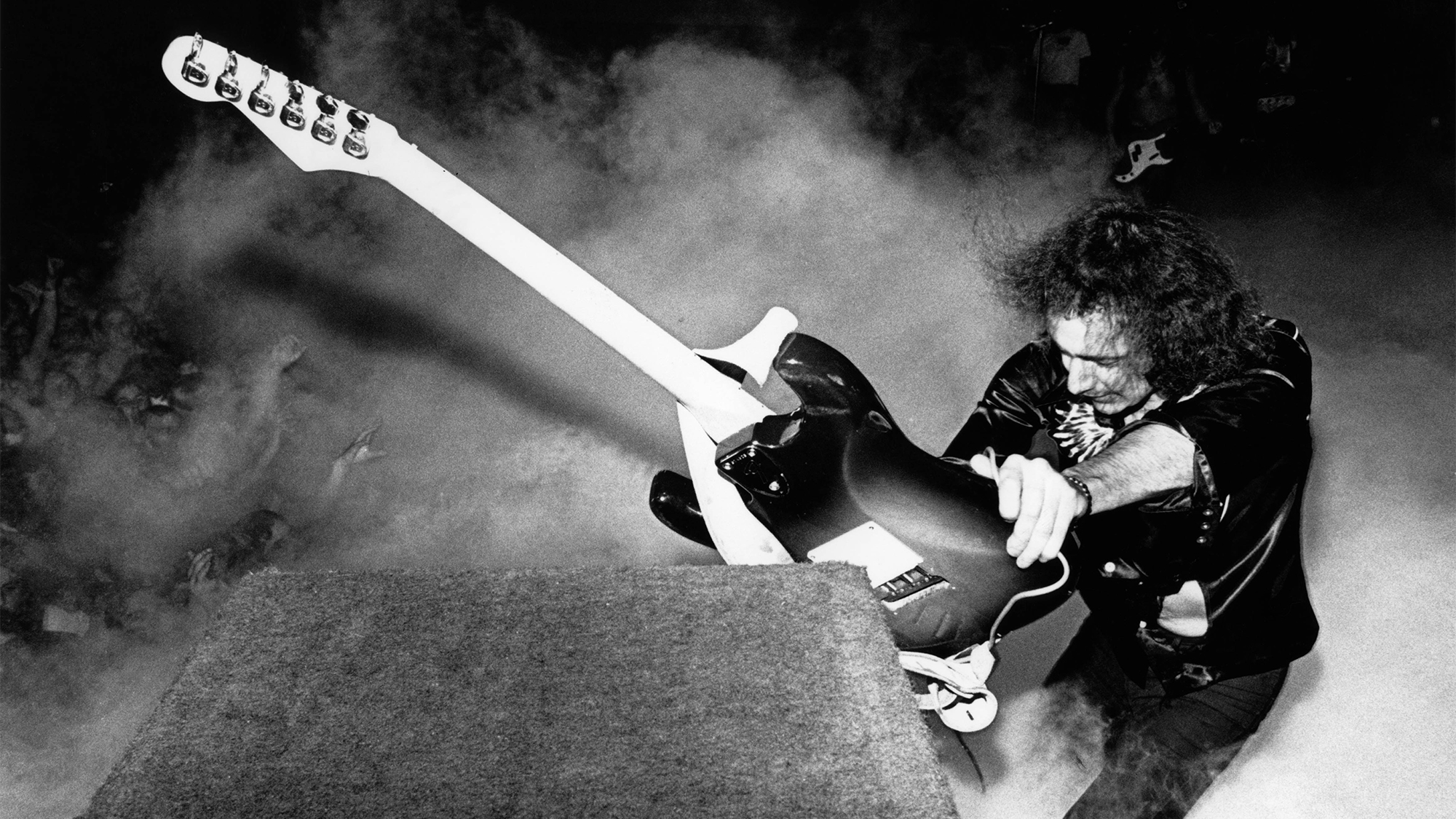 Ritchie Blackmore performing live onstage during the California Jam tour, smashing guitar against amplifier on US tour, 6th April 1974.