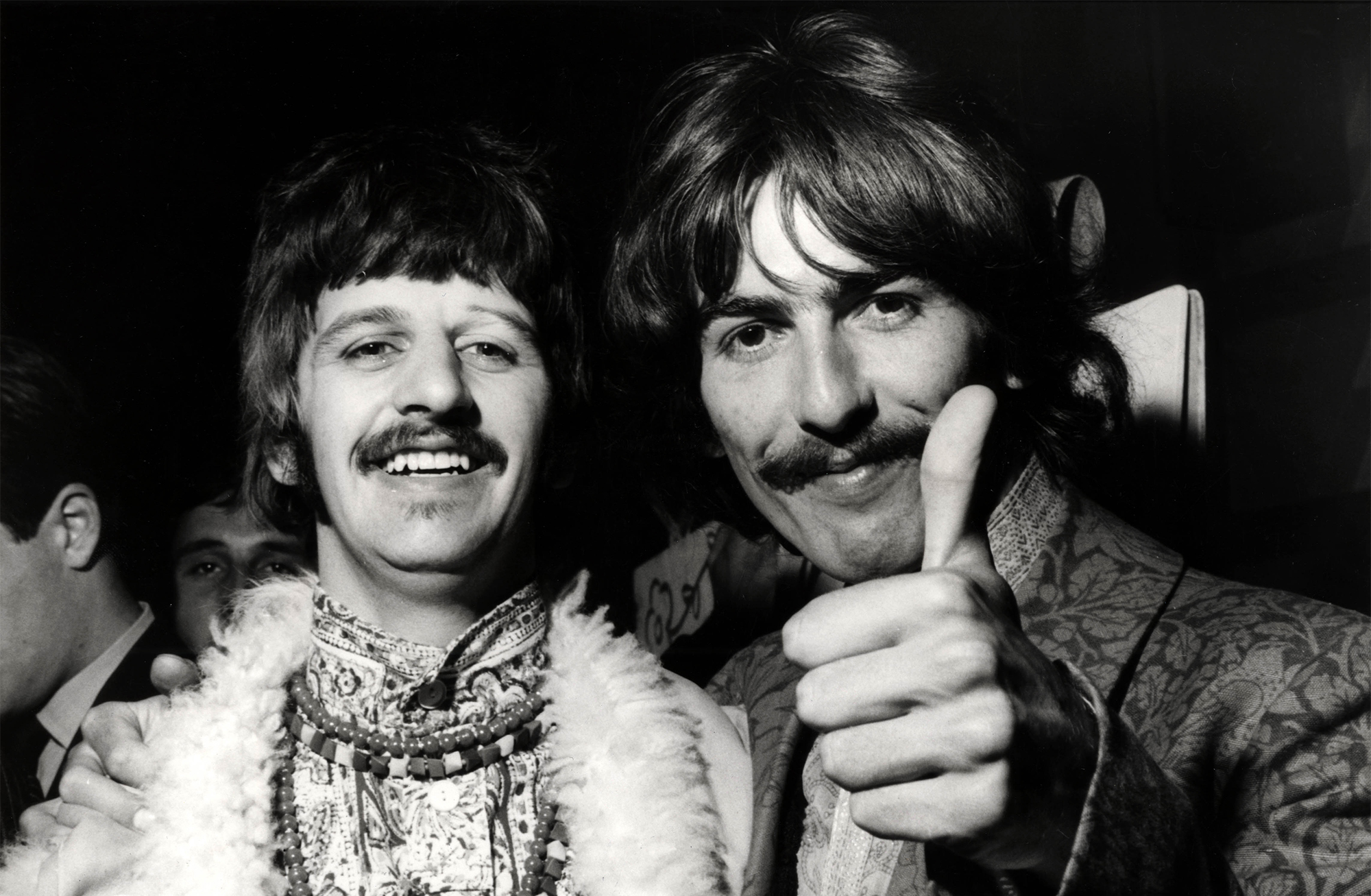 Ringo Starr, George Harrison posed, doing thumbs up, at the Beatles&rsquo; recording session for 'All You Need Is Love' on June 25, 1967