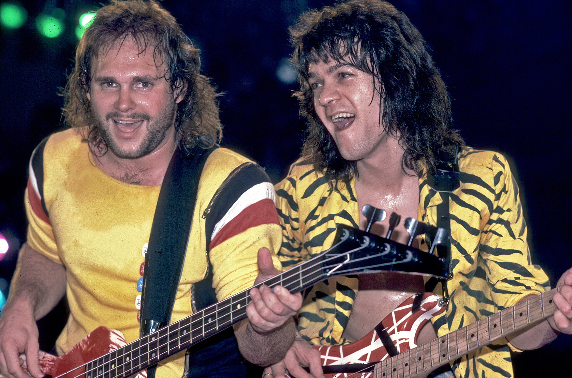 Michael Anthony (left) and Eddie Van Halen (1955 - 2020), both of the group Van Halen, perform onstage at the Jacksonville Coliseum, Jacksonville, Florida, January 18, 1984.