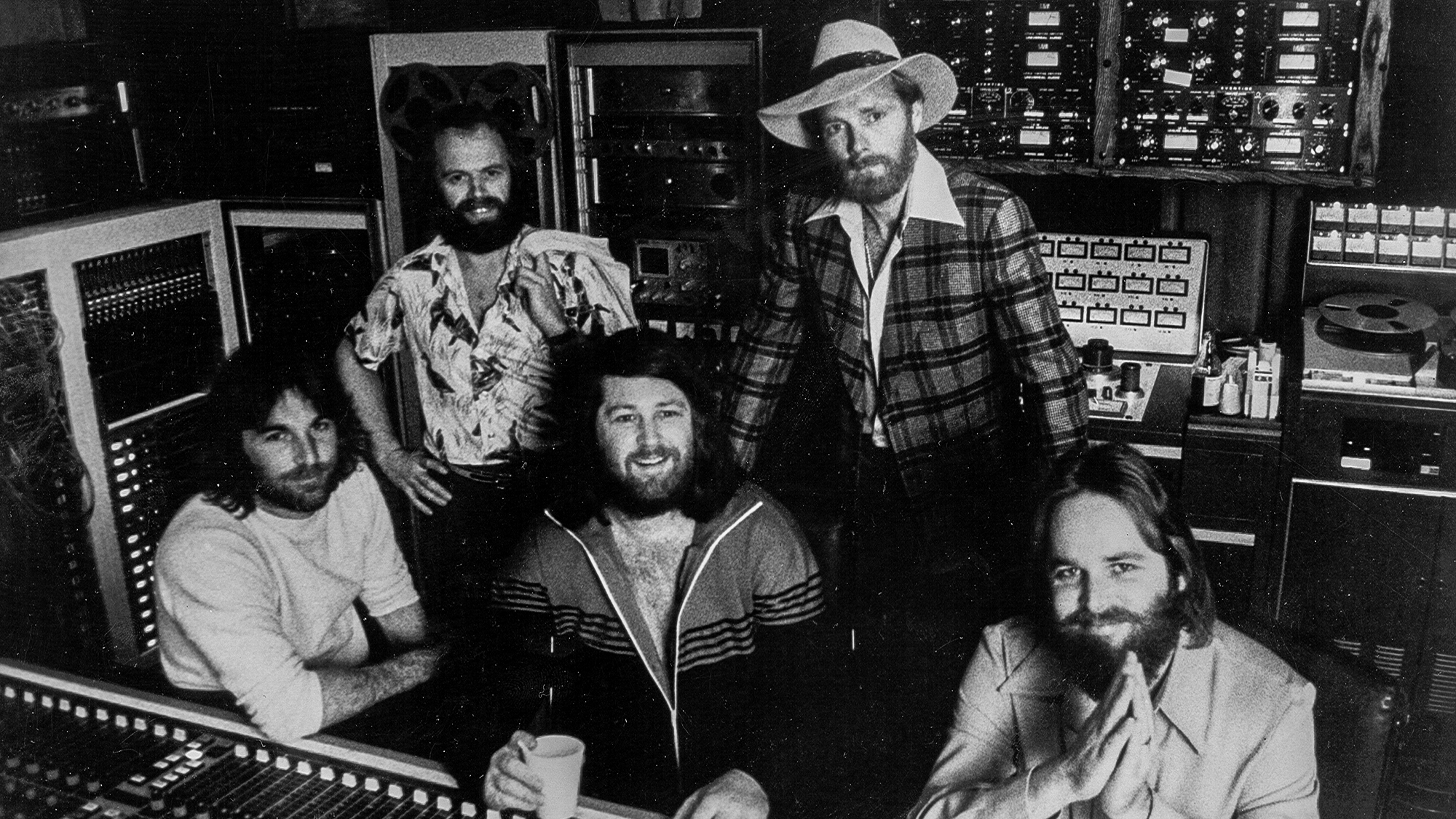 The Beach Boys pose for a portrait in their Brothers recording studio in 1976. Clockwise from left: Dennis Wilson, Al Jardine, Mike Love, Carl Wilson, Brian Wilson.