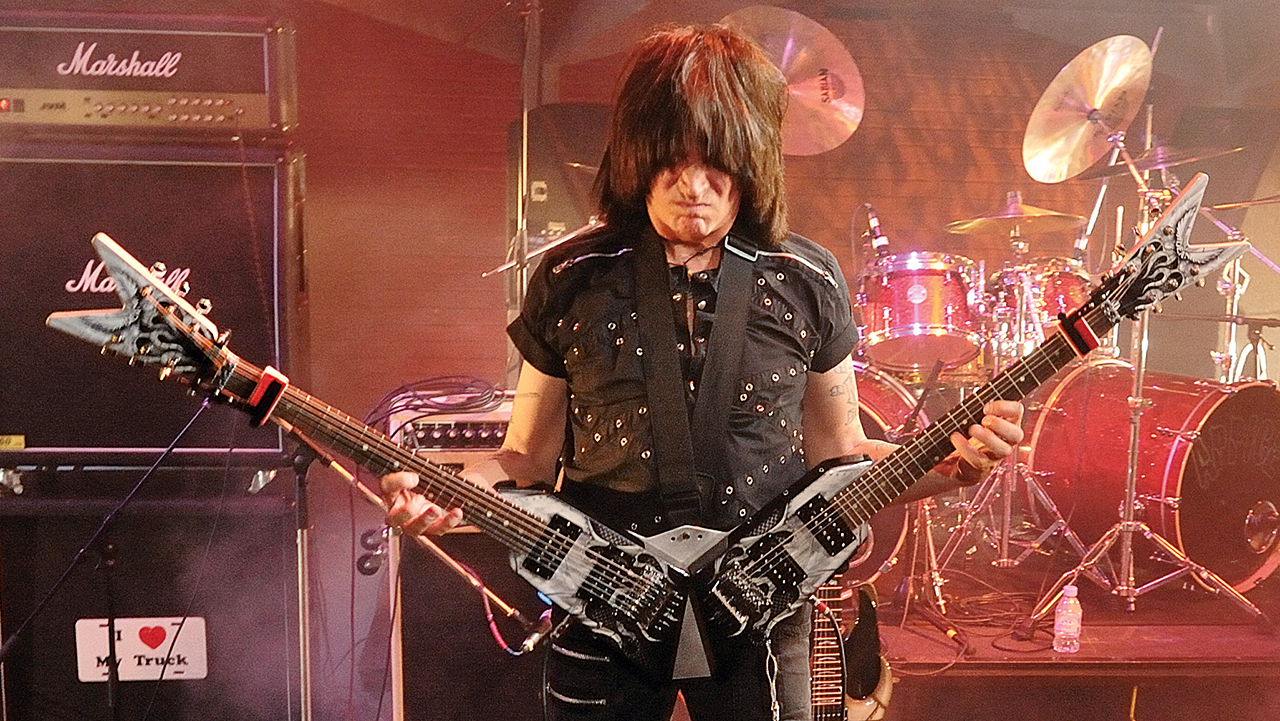 Michael Angelo Batio performing at a Dean Guitars event in London with his custom dual-neck guitar, taken on August 11, 2009
