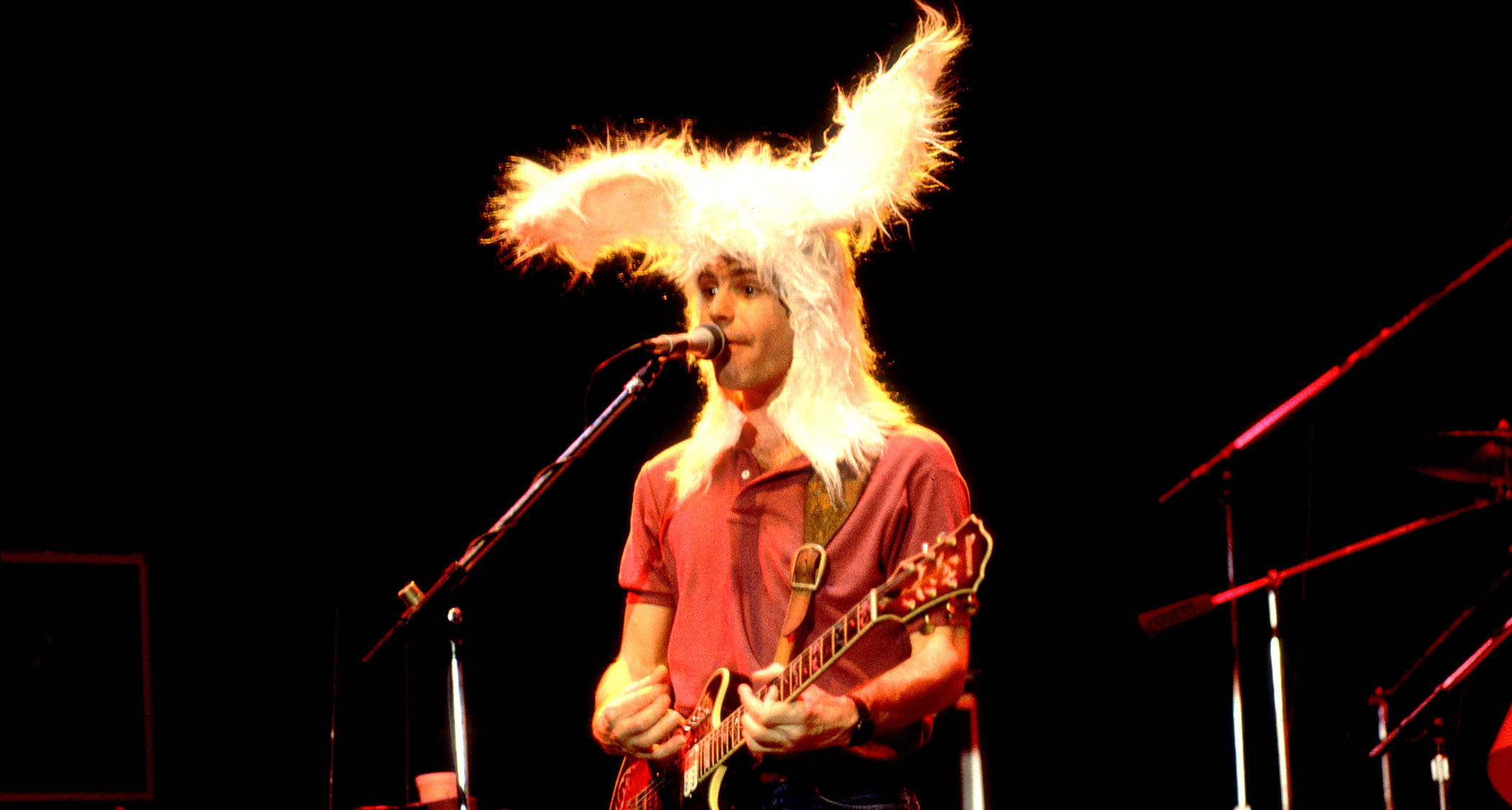 Bob Weir performs with his group in 1978, wearing large furry bunny ears.