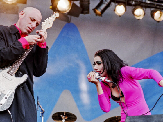 P.J. Harvey on why she stopped playing guitar onstage — and the real reason she chose her first pair of tour guitarists: “So I can look at their behinds.”