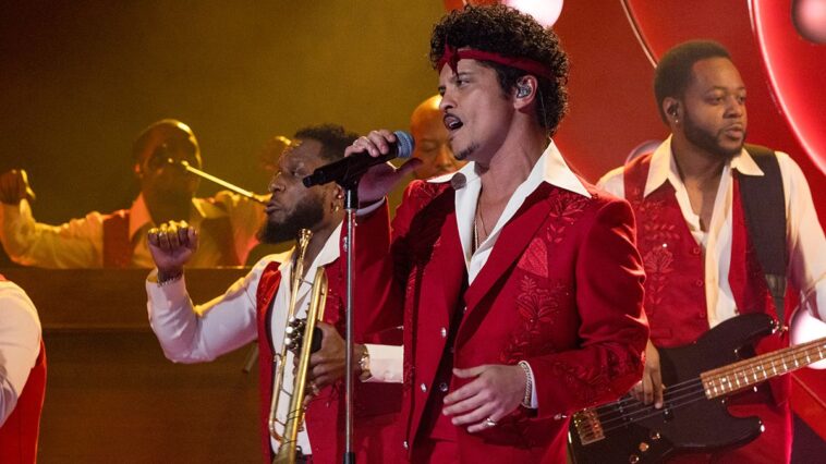 "After strumming the acoustic guitar and jamming with Bruno's freestyle vocals, we sparked the concept for the song: How Bruno Mars' new single 'Risk It All' might have turned out entirely differently."]