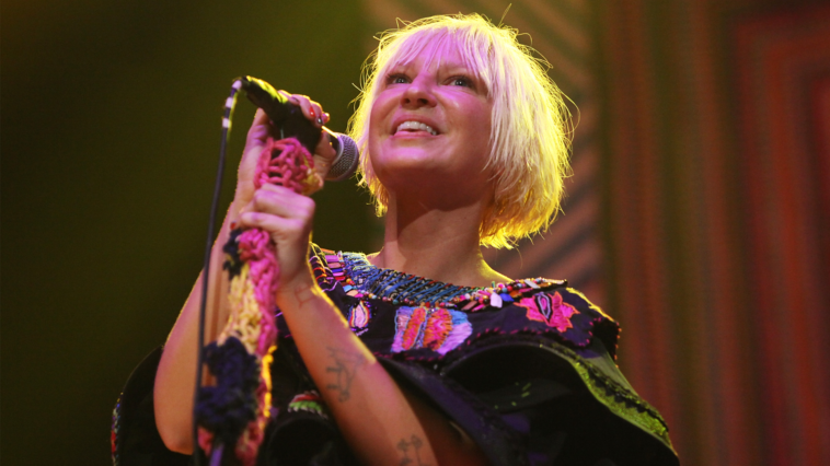 “Better Left Undiscussed: The Controversial Background of the David Guetta Monument That Catapulted Sia into the Spotlight”]