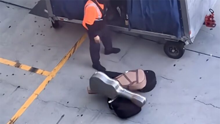 Considering bringing your guitar as checked baggage on your next flight? This may change your mind.]
