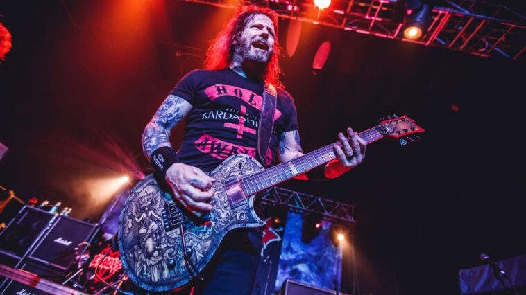 Gary Holt injures himself from intense headbanging.]