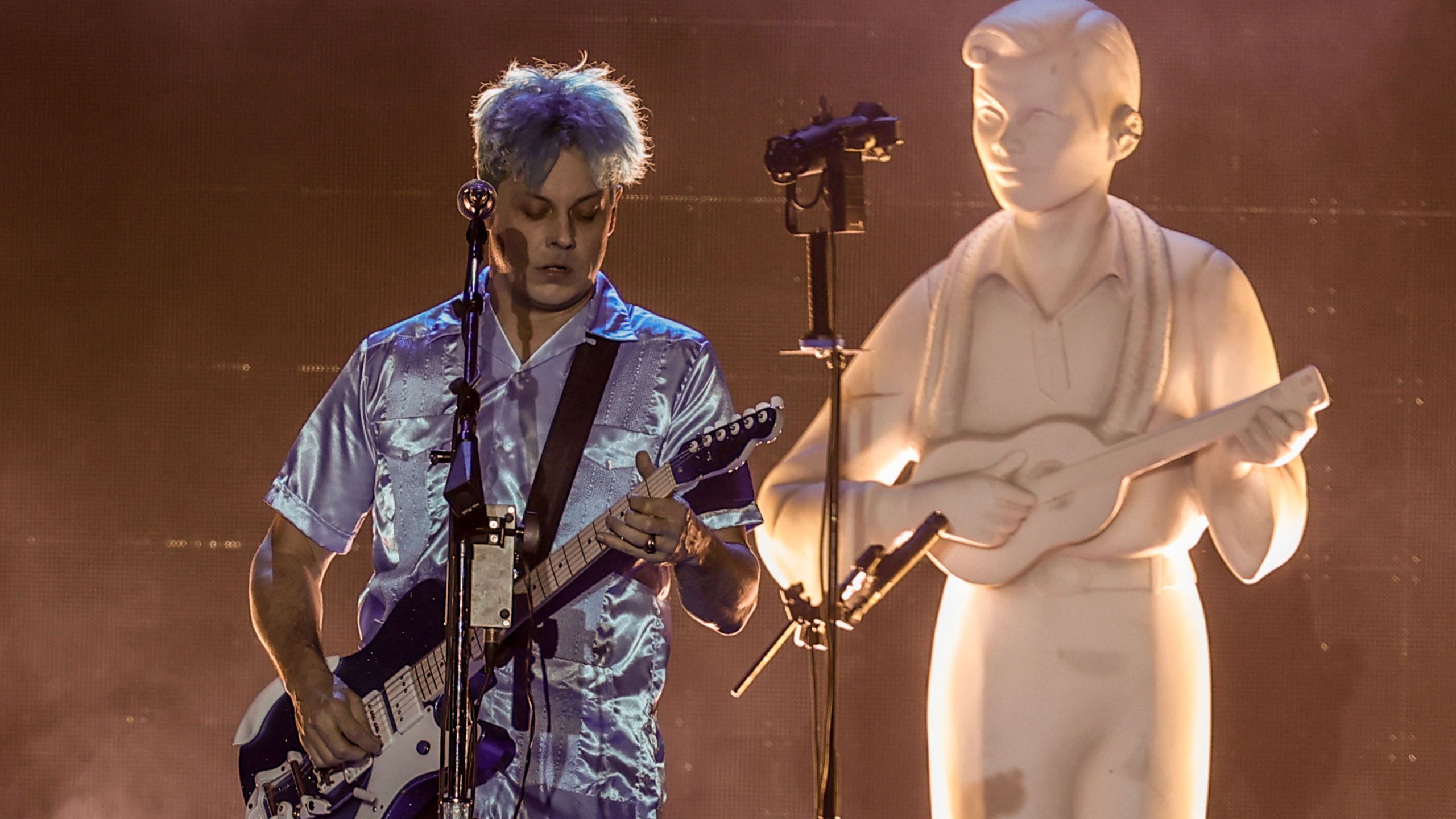 "Jack White explains why he avoids writing protest songs, referencing Dylan's notion that the answer is 'blowing in the wind' without revealing what that answer is."]