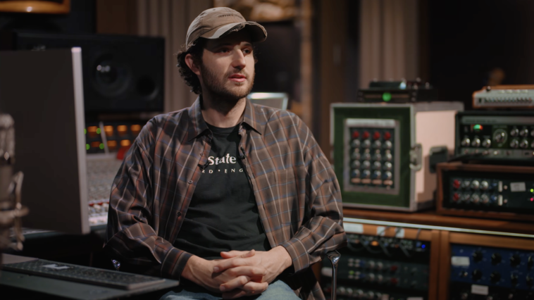 “Jim-E Stack unveils the low-fidelity production methods behind Bon Iver's 'Walk Home,' explaining that the Juno-DS keyboard was directly connected to Logitech speakers without any board or interface.”]