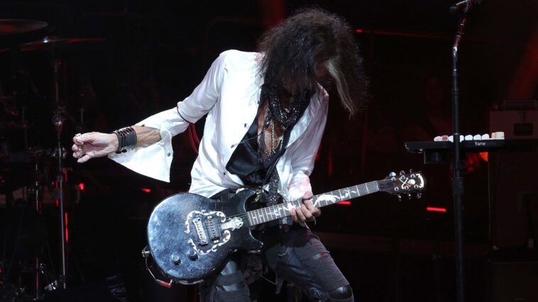 Joe Perry had to save a damaged guitar from Steven Tyler.]
