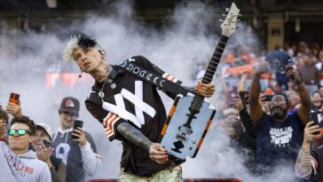 Machine Gun Kelly injures hand on large thorn during music video shoot]