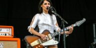 "P.J. Harvey Reveals Why She Gave Up Playing Guitar on Stage and Her Surprising Choice for Her Initial Tour Guitarists: 'I Chose Them Just to Admire Their Rear Ends.'"]
