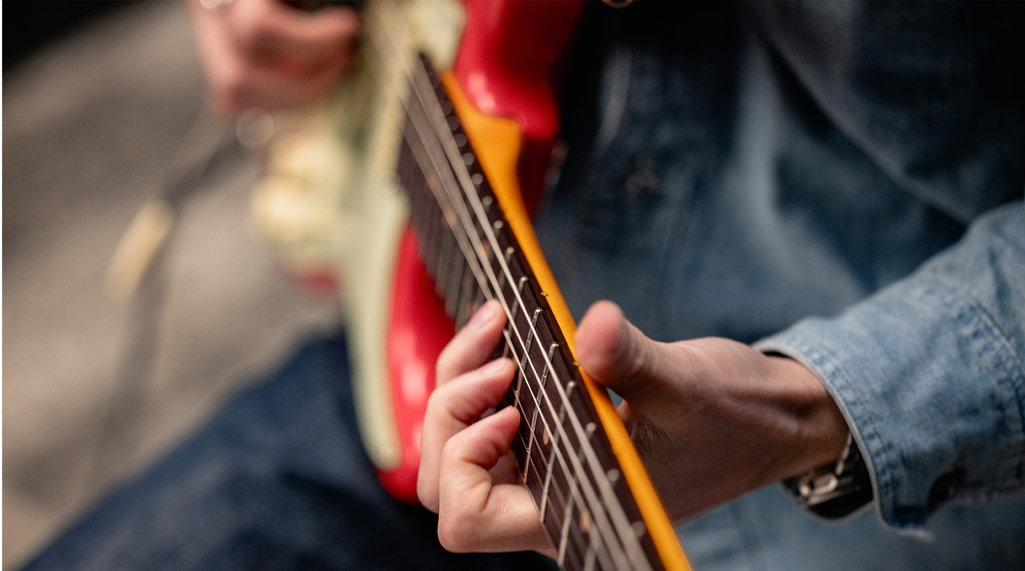 A detail photo of the Fender American Ultra Luxe Vintage &rsquo;60s Stratocaster HSS in Fiesta Red