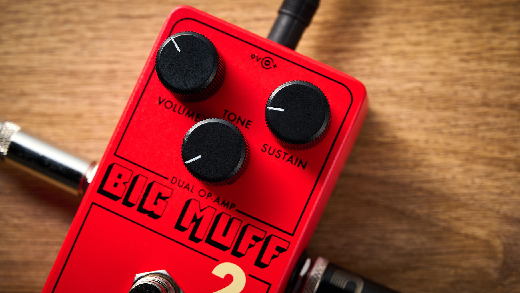 Electro-Harmonix Big Muff Pi 2 Dual Op-Amp Fuzz is built from a lost schematic that's 50 years old but the form factor is familiar for contemporary EHX stompboxes, a three-knob fuzz, red enclosure.