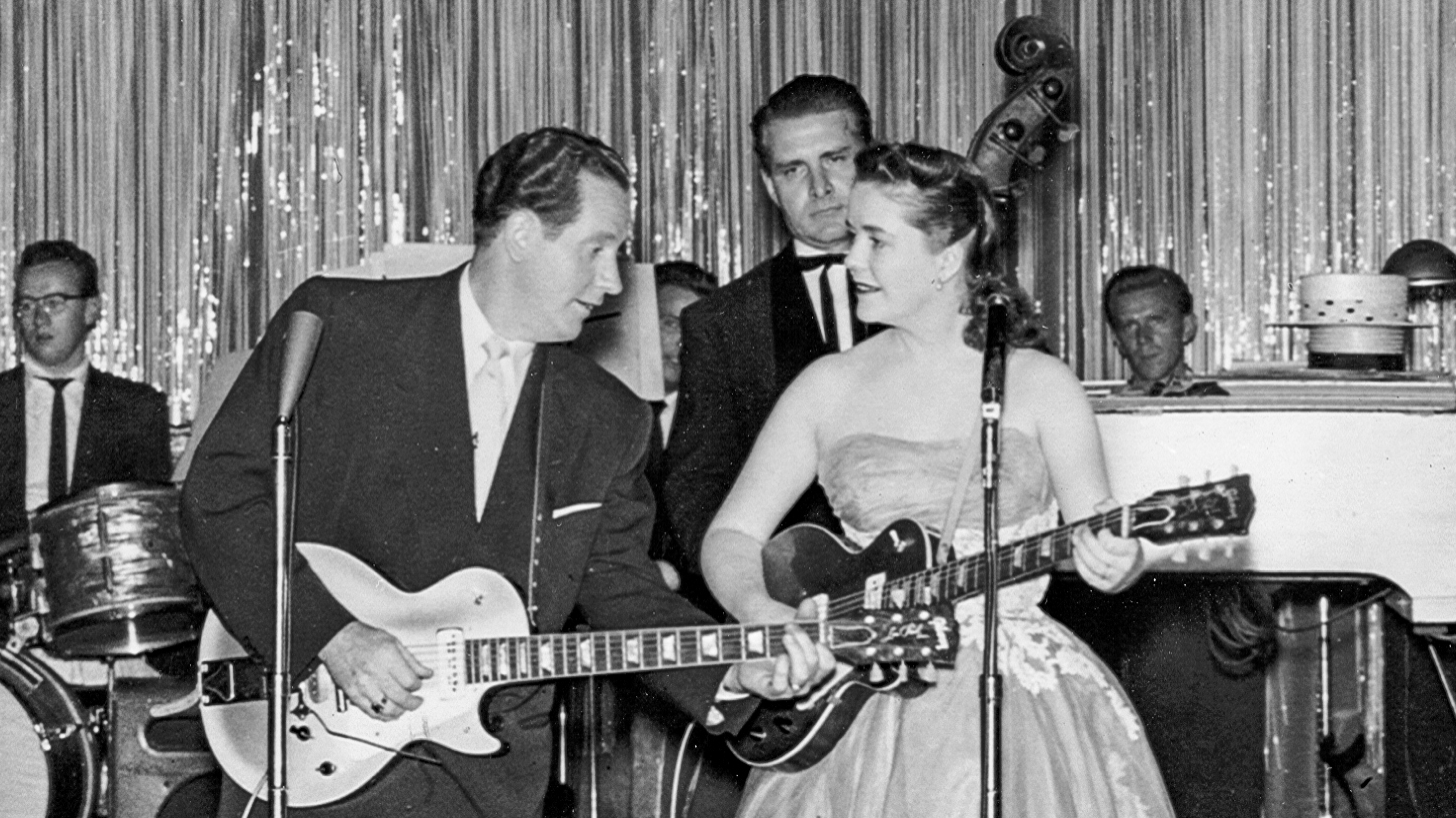 CAMDEN, NJ - SEPTEMBER 20: Husband and wife singer/songwriter duo Les Paul &amp; Mary Ford perform onstage with Gibson Les Paul acoustic guitars and a full back up band at Chubby's "Home of the stars" on September 20, 1953 in Camden, New Jersey.