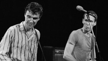 “Upon entering the spacious room, I found Tina visibly distraught. She asked me, ‘If we let David go, would you consider joining the band?’”: Adrian Belew claims he was approached about replacing David Byrne in Talking Heads.]