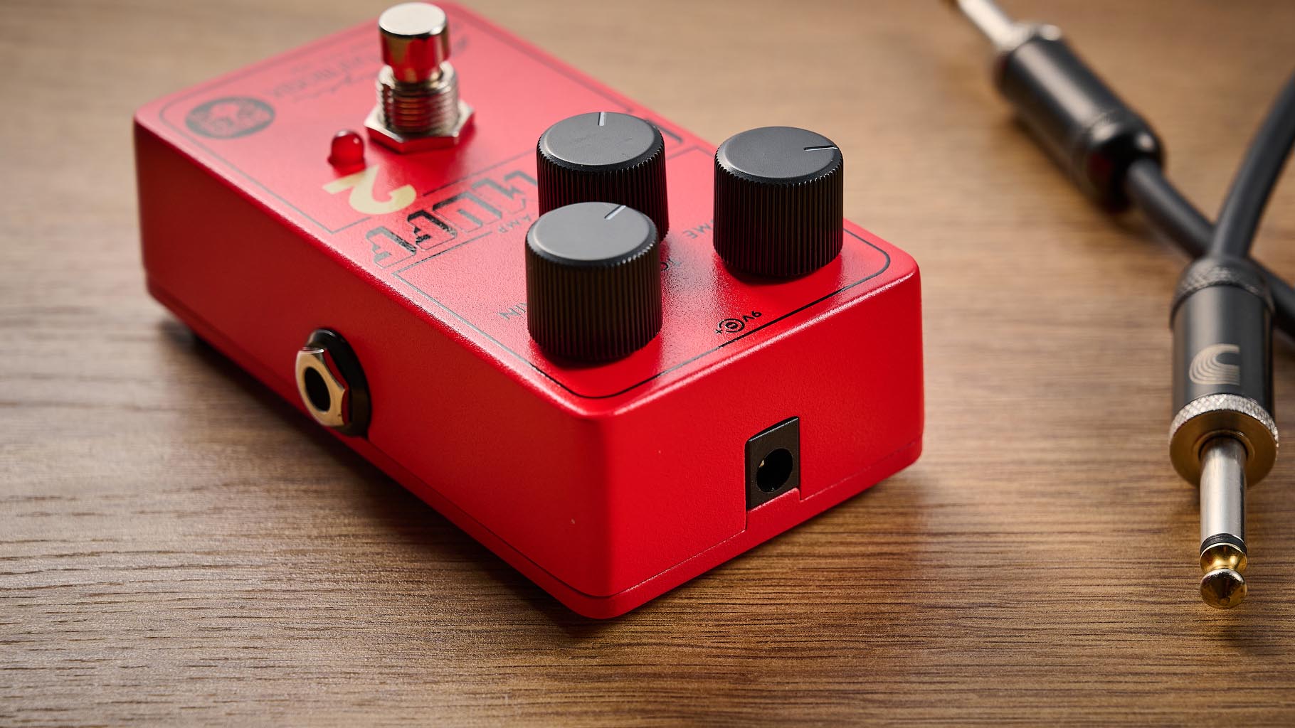 Electro-Harmonix Big Muff Pi 2 Dual Op-Amp Fuzz is built from a lost schematic that's 50 years old but the form factor is familiar for contemporary EHX stompboxes, a three-knob fuzz, red enclosure.