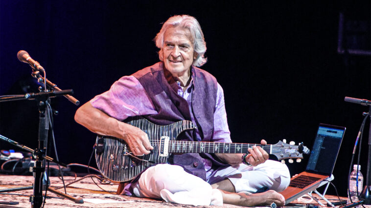 “Come on, get a move on!” John McLaughlin recalls the night Ginger Baker started throwing drumsticks at Jack Bruce