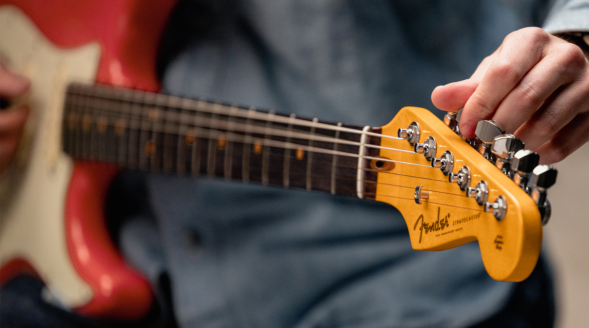 A detail photo of the Fender American Ultra Luxe Vintage &rsquo;60s Stratocaster HSS in Fiesta Red